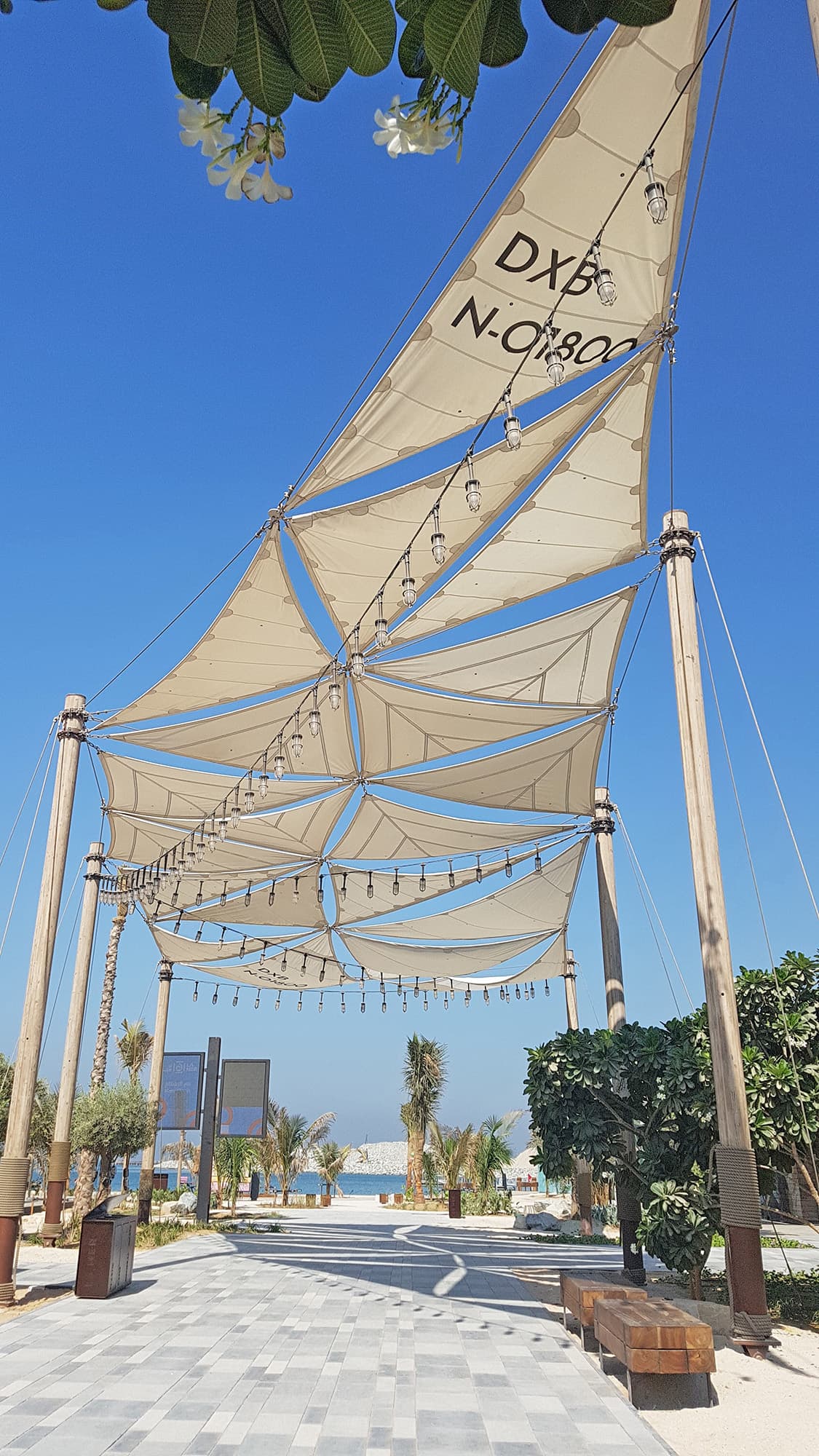 Project in Dubai featuring a shade sail system and wooden masts